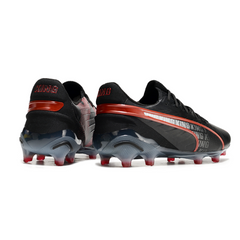 Scarpa da calcio Puma King Ultimate nera e rossa per terreni compatti FG