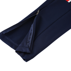 Conjunto Adidas Cold Set azul oscuro, blanco y rojo: chaqueta y pantalón.