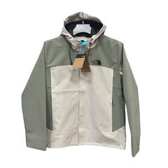 Chaqueta cortavientos verde y blanca de The North Face