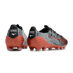 Bota de fútbol Mizuno Alpha negra y roja para terreno firme FG