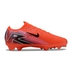 Botas de fútbol Nike Air Zoom Mercurial Vapor 16 Elite rojas y negras para niños, para terreno firme (FG).