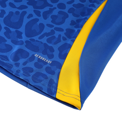 Conjunto Adidas Cold Set azul, amarillo y negro: camiseta y pantalón con cremallera de un cuarto.